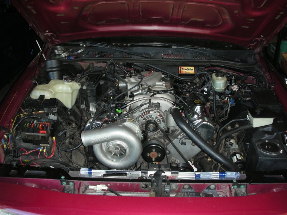 1992 Ford Crown Victoria engine bay with a large Paxton supercharger installed