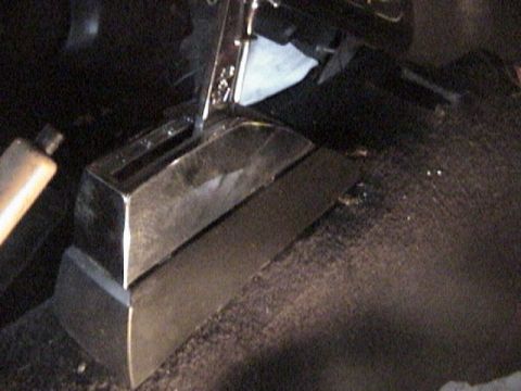 1977 Ford Mustang - The image shows an aftermarket shifter console, not a 1977 Ford Mustang.