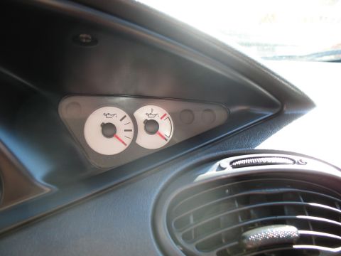 1993 Ford Bronco - Close-up of the interior gauges, showing oil level indicators and an air vent.