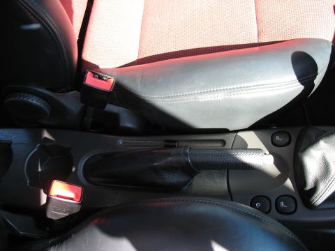 1993 Ford Bronco - Close-up view of the interior of a car, focusing on the seating and center console area.