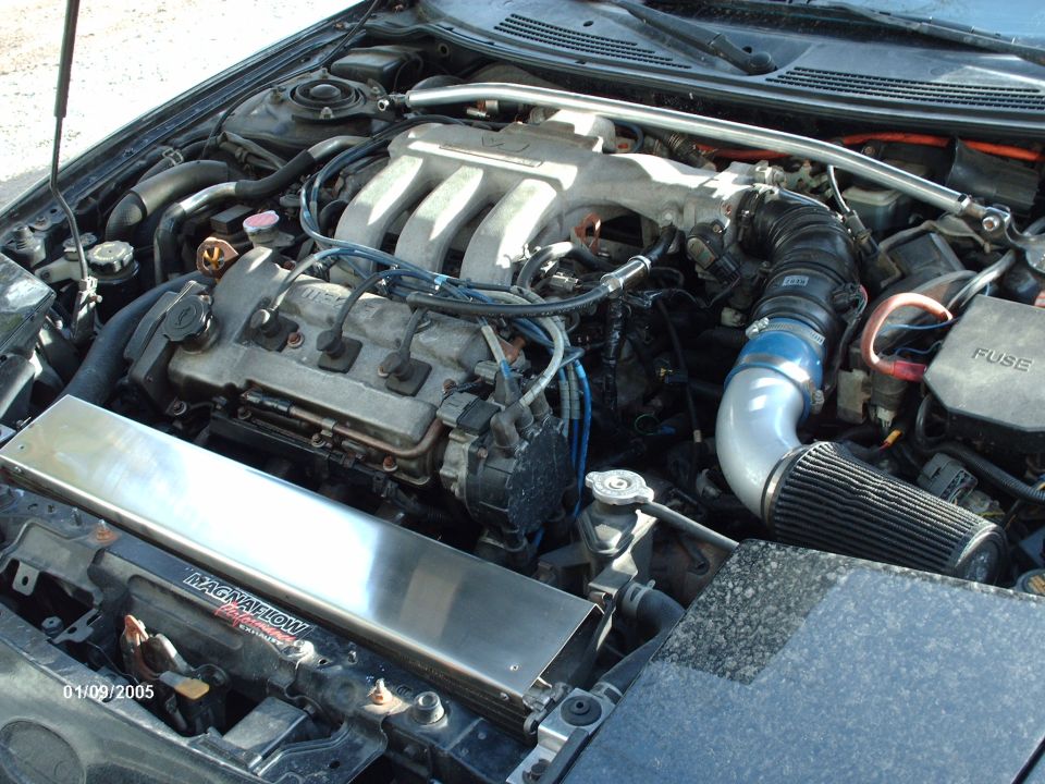 Engine bay with V6 intake manifold and aftermarket air filter