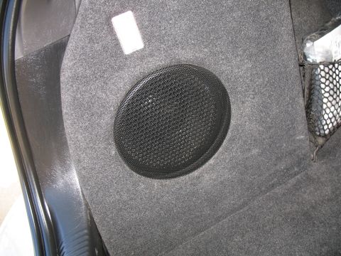 1993 Ford Bronco - Interior panel shows a speaker and a cargo net, not a 1993 Ford Bronco.