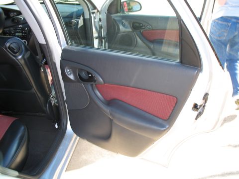 1993 Ford Bronco - Interior view of a car door panel with red fabric accents and black trim.