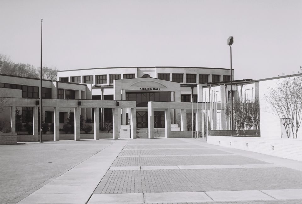 Kisling Hall building entrance with colonnades and paved courtyard
