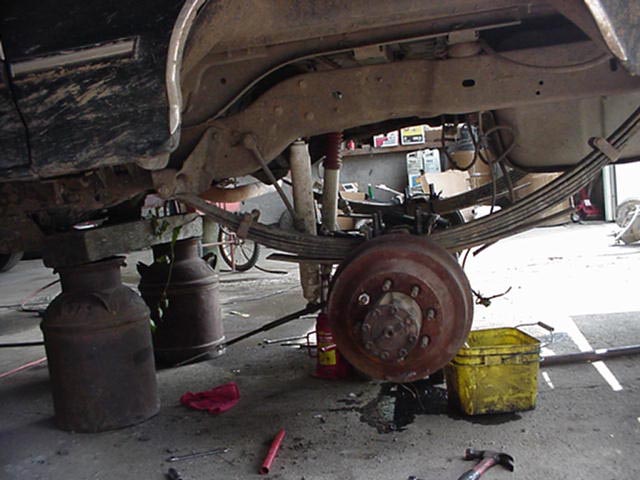 in.  drilled th rut out of the perches, used the same wedge block, bolted it up.  the f 350 sprinh plate need a bigger hole the middle, so i cut it out some with the torch.  plug in the sensor, and good to go.  do the brakes.