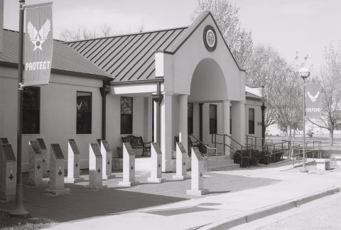 1973 Ford Ranchero - Exterior view of a building with Air Force banners and memorial plaques.