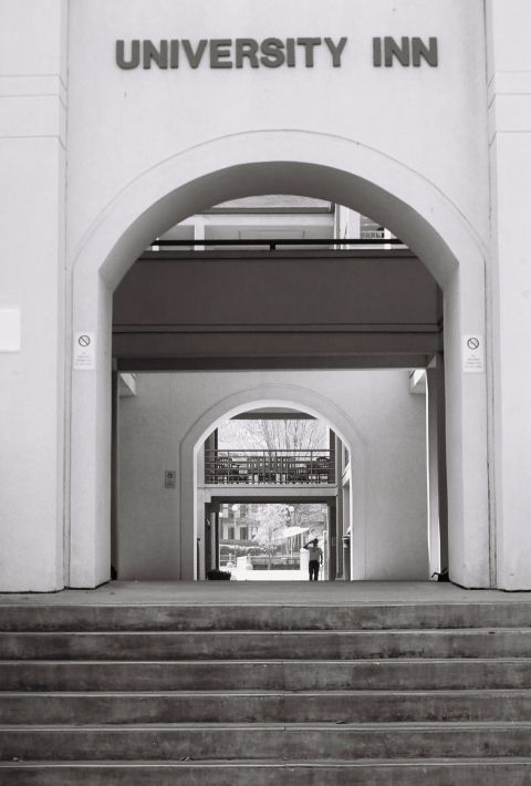 1973 Ford Ranchero - Entrance to the University Inn features multiple arches and concrete stairs leading to an open courtyard.