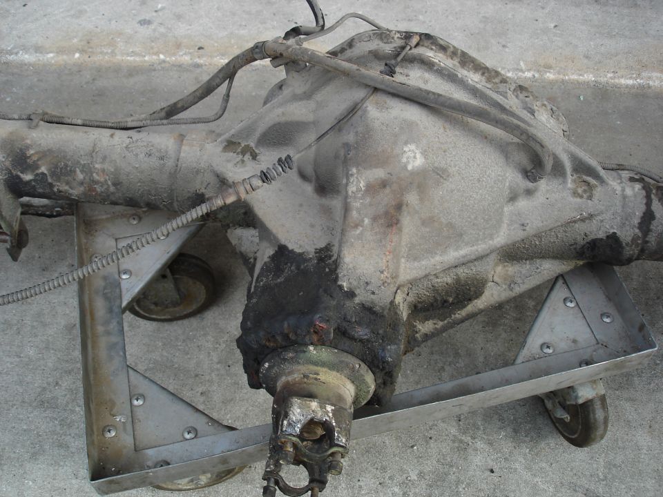 Removed differential housing on a rolling shop dolly
