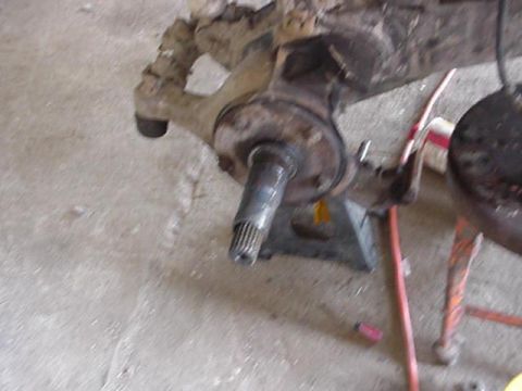 1992 Ford Bronco - remove the 5 lug hub assmebly, spindle, caliper braket and caliper. the same brake lines, axleshafts, and hubs are used.