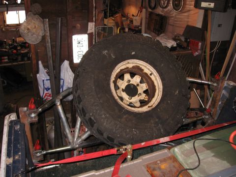 1980 Ford Bronco - Eventually the side panels will tie to the carrier through some bushings. Right now the ratchet strap is holding them into place.