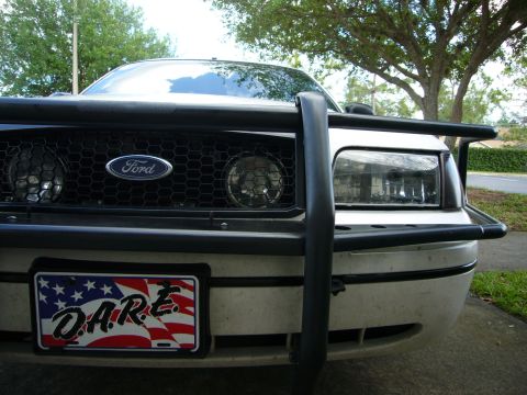 2000 Ford Crown Victoria - Front view of a 2000 Ford Crown Victoria, equipped with a push bar and a D.A.R.E. license plate.