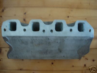1972 Ford Ranchero - This is an intake manifold, not a 1972 Ford Ranchero. The part has four distinct intake ports visible.