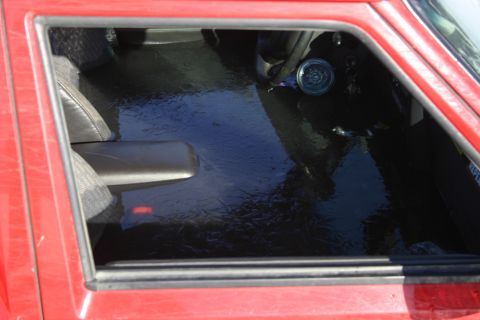 2003 Jeep TJ - The interior of a vehicle is covered in a layer of ice, indicating freezing temperatures.