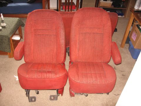 1990 Ford Bronco - Two red car seats are shown removed from a vehicle, with a watermark at the bottom right.