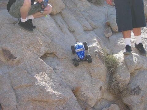 1985 Ford Bronco - Remote control rock crawler navigating a challenging rocky terrain.