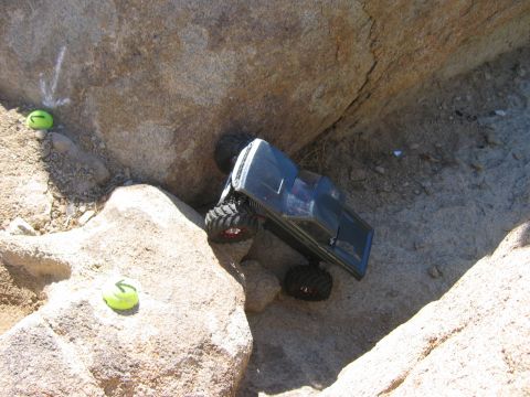 1985 Ford Bronco - RC truck climbing rocks, with tennis balls indicating course markers.