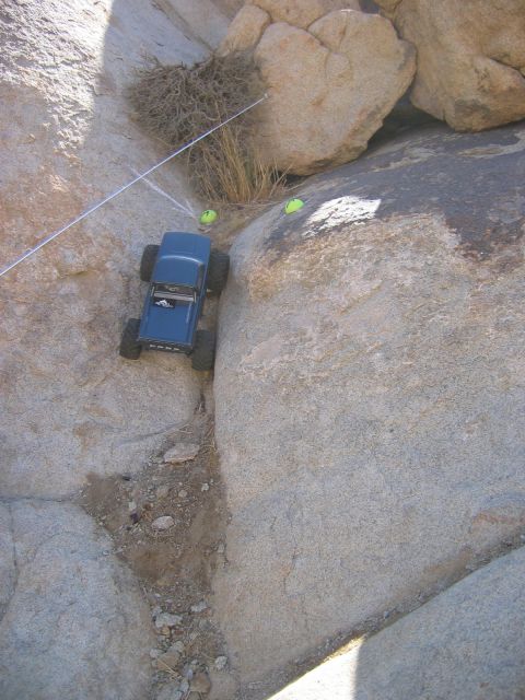 1985 Ford Bronco - A remote-controlled vehicle attempts to traverse a challenging rocky terrain.