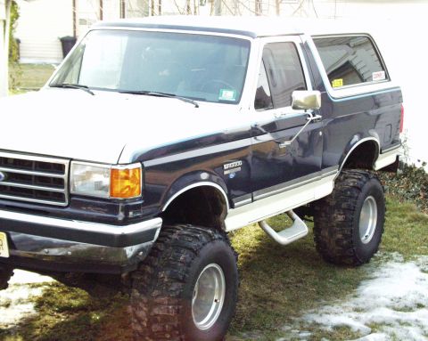 1989 Ford Bronco - This lifted 1989 Ford Bronco is equipped with large off-road tires and sits high off the ground.
