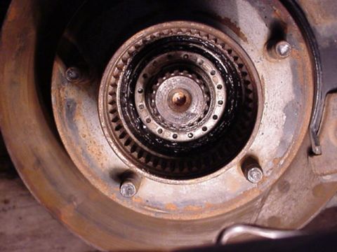 1992 Ford Bronco - after you remove the first nut, you will see this, its a lockring you need to pic out, then remove the spindle nut form behind it.