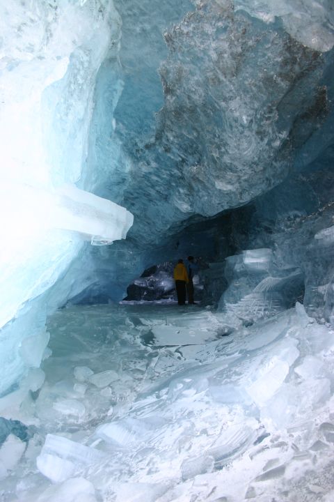2003 Jeep TJ - Exploring a glacial ice cave with striking blue ice formations and frozen water.