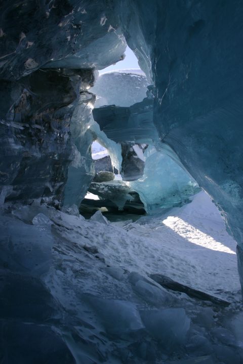2003 Jeep TJ - Sunlight filters through the intricate ice formations of a glacial cave.