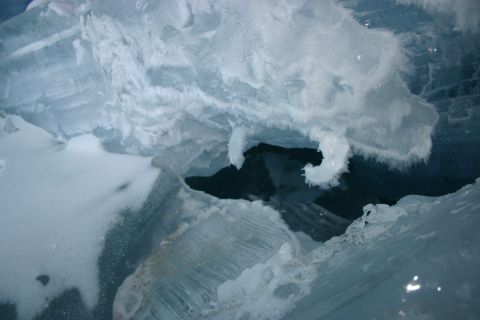 2003 Jeep TJ - Ice formations with dark water visible through cracks.