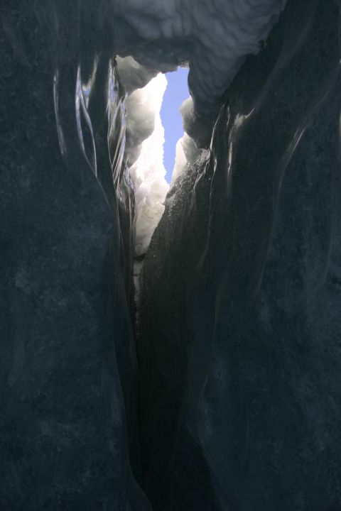 2003 Jeep TJ - Looking up through a narrow crevice in an ice cave to the bright blue sky.