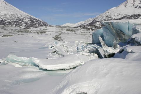 2003 Jeep TJ - A vast, snow-covered landscape with jagged ice formations and distant mountains.