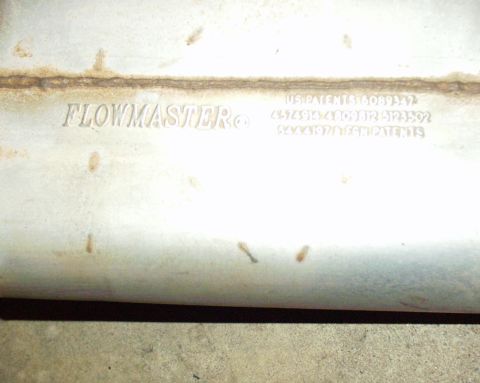 1989 Ford Bronco - Close-up of a Flowmaster muffler showing stamped patent information.