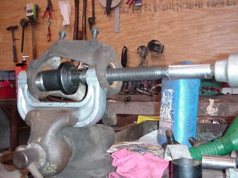 1992 Ford Bronco - using a balljoint press to remove and install the balljoints. can be rented at autozoe, andother parts stores.