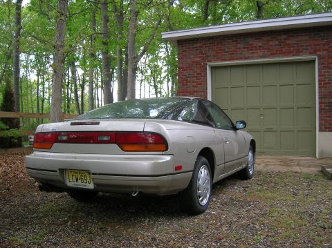 1992 Nissan 240SX - Rear view of a 1992 Nissan 240SX with a New Jersey license plate parked next to a brick garage.