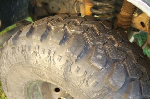 1987 Ford Bronco - Off-road tire and suspension detail, likely from a truck or SUV.