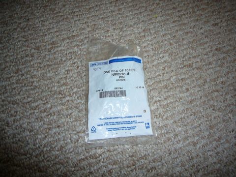 2000 Ford Crown Victoria - A sealed package of Ford parts is shown against a carpeted background.