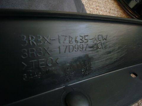 2000 Ford Crown Victoria - This black plastic automotive part displays embossed part numbers, including 3R3X-17B635-ACW and 3R3X-17D997-ACW.