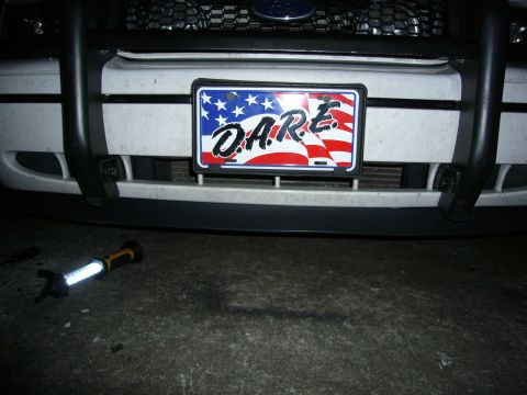 2000 Ford Crown Victoria - Front view of a 2000 Ford Crown Victoria, a D.A.R.E. license plate and a black push bar.