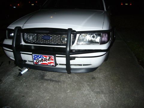 2000 Ford Crown Victoria - This Ford Crown Victoria features a push bar and a D.A.R.E. license plate, suggesting a law enforcement or community service connection.