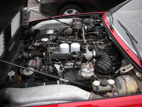 1998 Ford Crown Victoria - Close-up of a Ferrari V12 engine, showing intake and fuel systems.