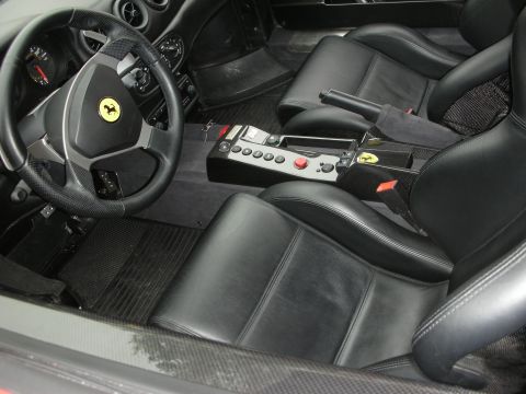 1998 Ford Crown Victoria - Interior view of a luxury car, showing black leather seats and a detailed dashboard.
