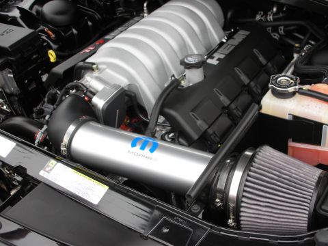 1998 Ford Crown Victoria - The engine features a silver Mopar intake tube and a grey air filter, with 'HEMI' branding visible on the valve cover.