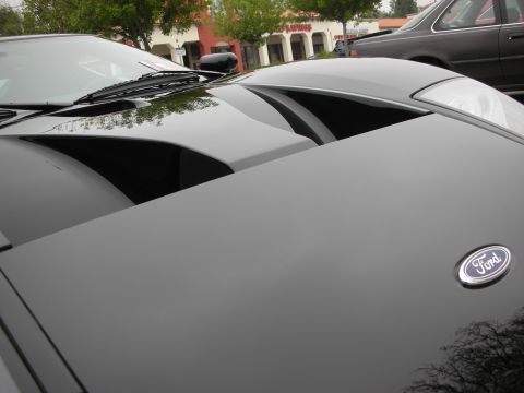 1998 Ford Crown Victoria - Close-up of the hood and air intakes on a black Ford GT.