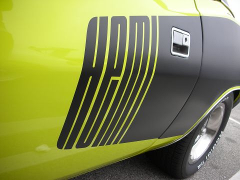 1998 Ford Crown Victoria - Side view of a car's rear quarter panel a prominent HEMI stripe graphic.