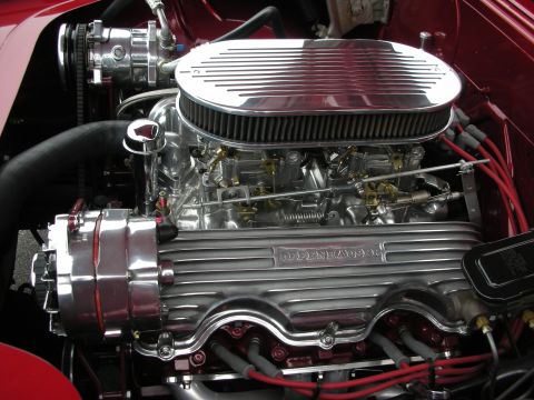 1998 Ford Crown Victoria - Close-up of a polished V8 engine, dual carburetors and prominent 'Oldsmobile Rocket' branding on the valve covers.