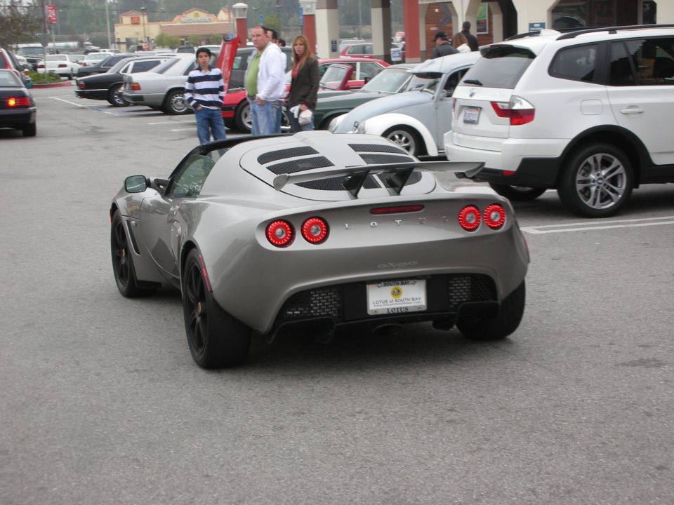 Silver Lotus Elise roadster rear view with round taillights