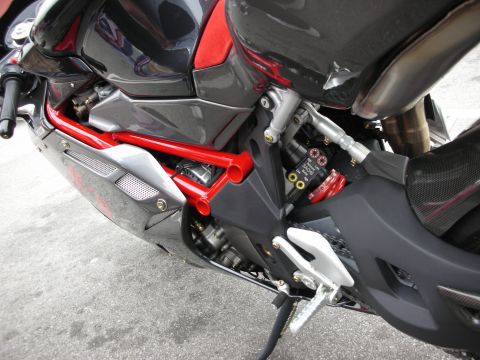 1998 Ford Crown Victoria - Close-up view of a motorcycle's mechanical components, including the frame, suspension, and footpegs.