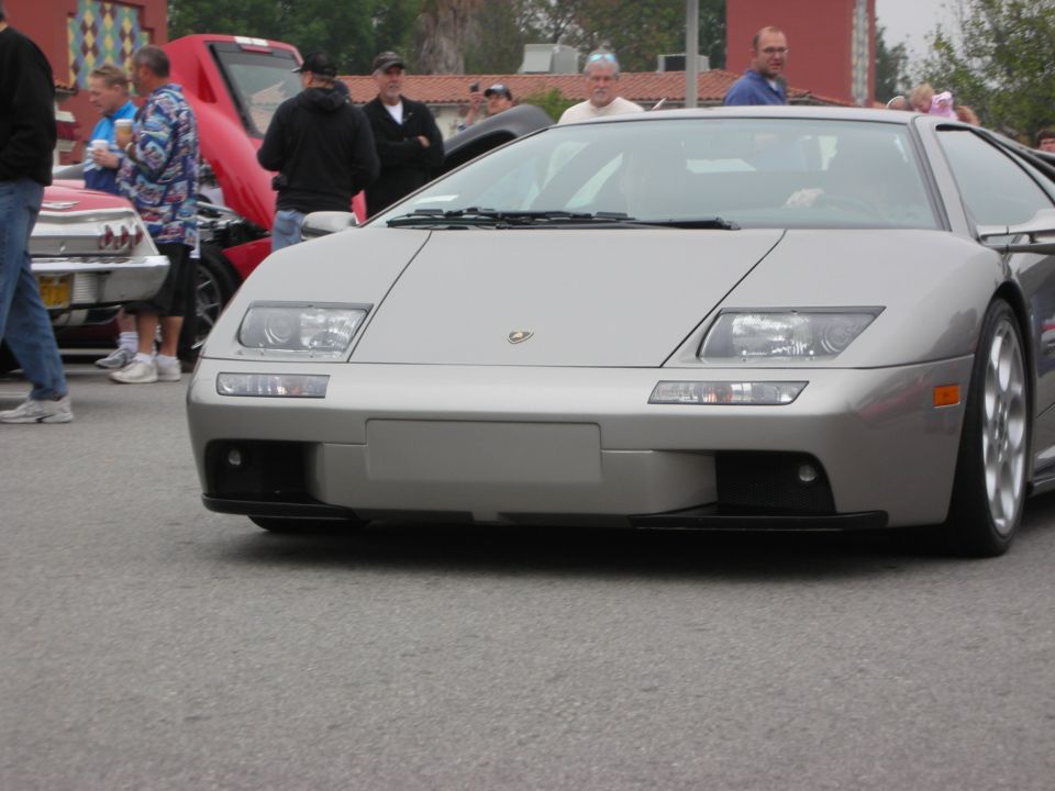 Silver Lamborghini Diablo front view in a crowd at a car show