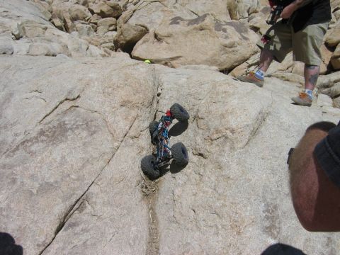 1985 Ford Bronco - A remote control rock crawler navigates a challenging rocky terrain.