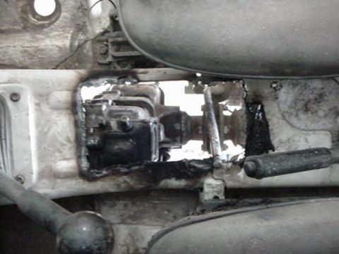 1992 Ford Bronco - bog hole for clearence up front, and longer for the different shifter angle. also bent the shifter handle