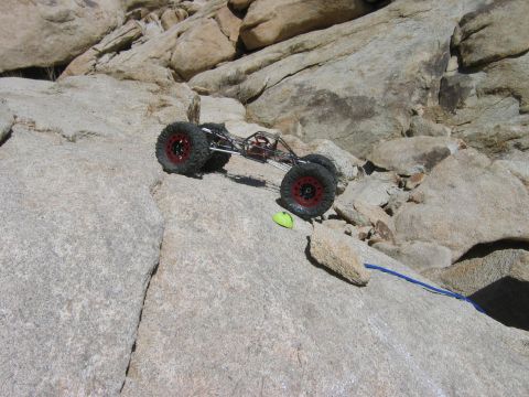 1985 Ford Bronco - A remote control rock crawler navigates a steep, rocky terrain.