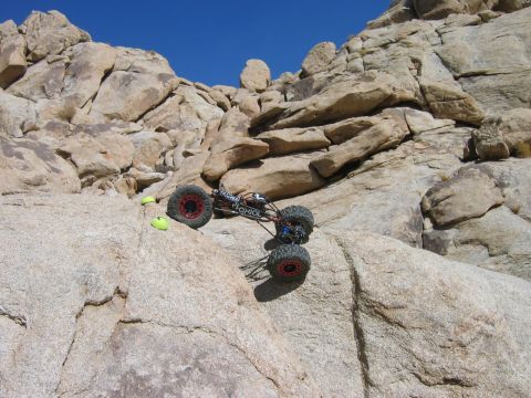 1985 Ford Bronco - A remote control rock crawler navigates a challenging rocky terrain.