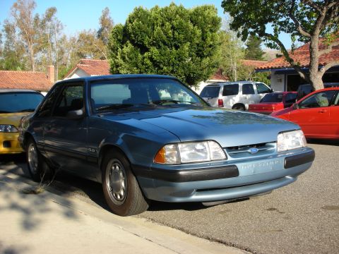 1990 Ford Mustang - Front view of a blue 1990 Ford Mustang coupe with a 5.0 badge.